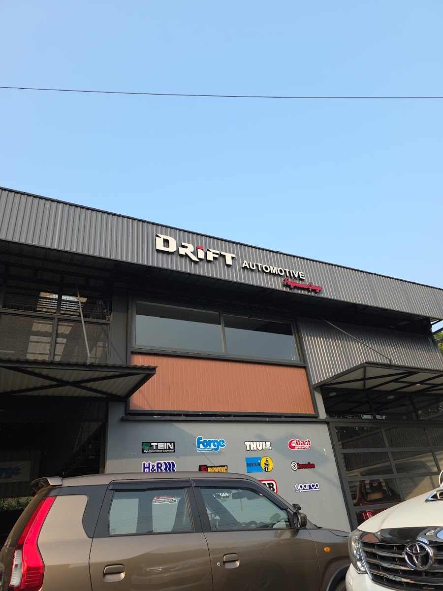 Drift Automotive building by day with the full brand wall