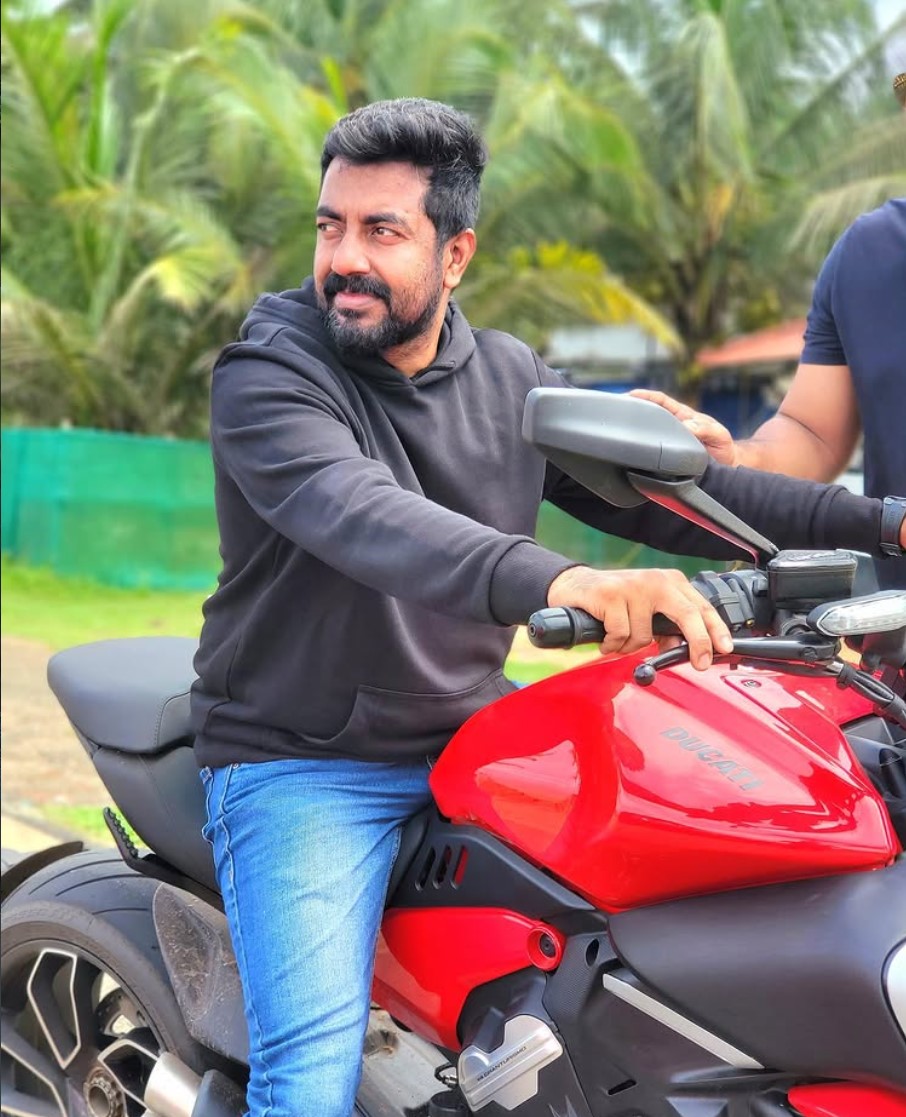 Saleem on a red Ducati at the Drift Automotive workshop